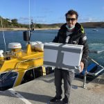 The Honey Boat, the queenless nuc arrives at Tresco from Bryer to introduce the new Colonsay queen with Andrew the local Boat man helping in transporting