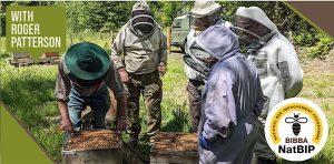 one day beekeeping event with Roger Patterson opening a hive